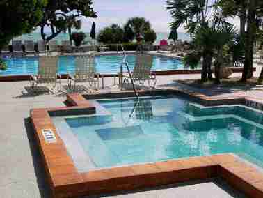 Pool and jacuzzi with tropical landscaping at the 1800 Atlantic Resort.